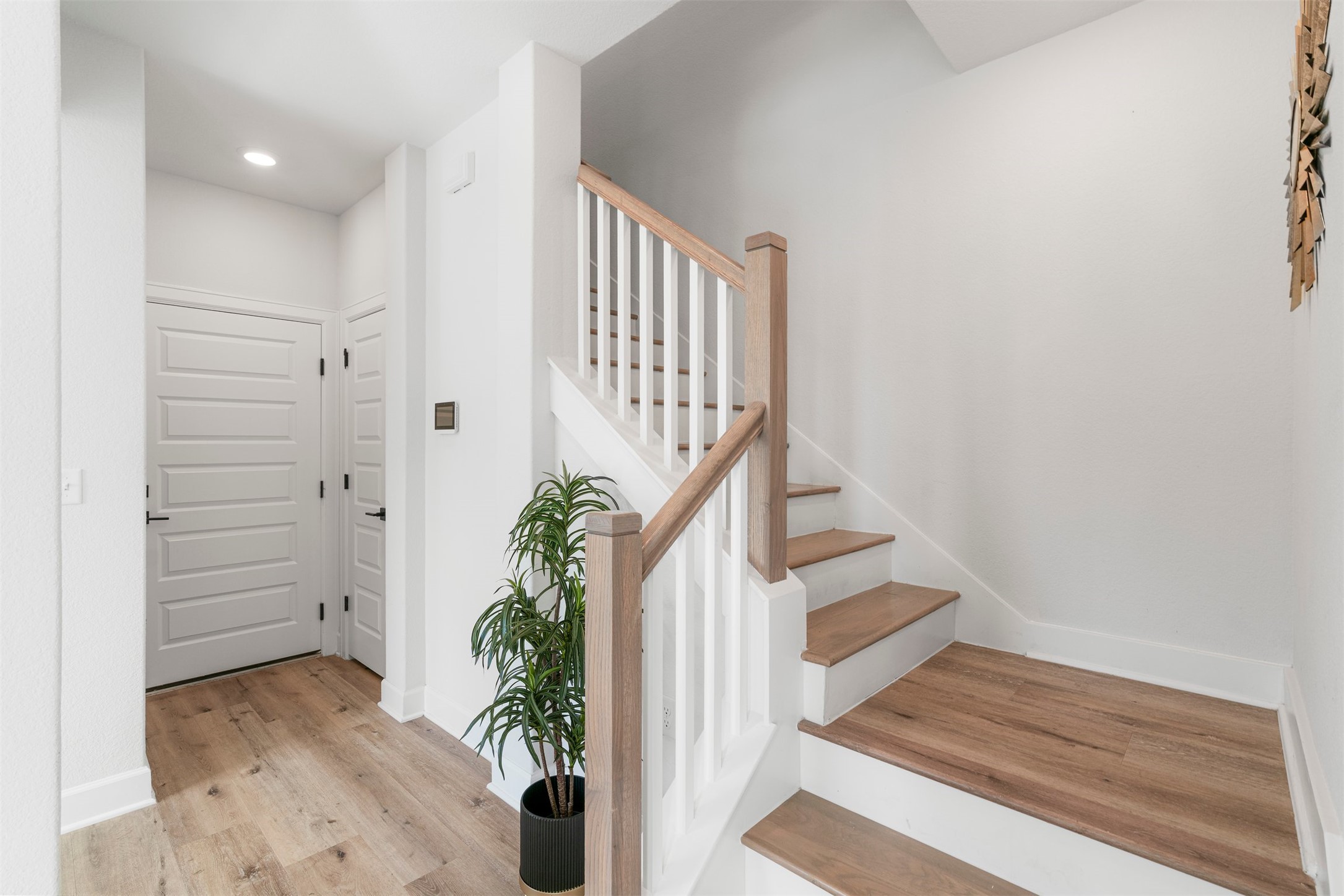 3900 Taniguchi Street Austin, TX 78723 - Photo 14 of 39 Head upstairs to enjoy the living, dining, and kitchen areas, along with the primary bedroom.