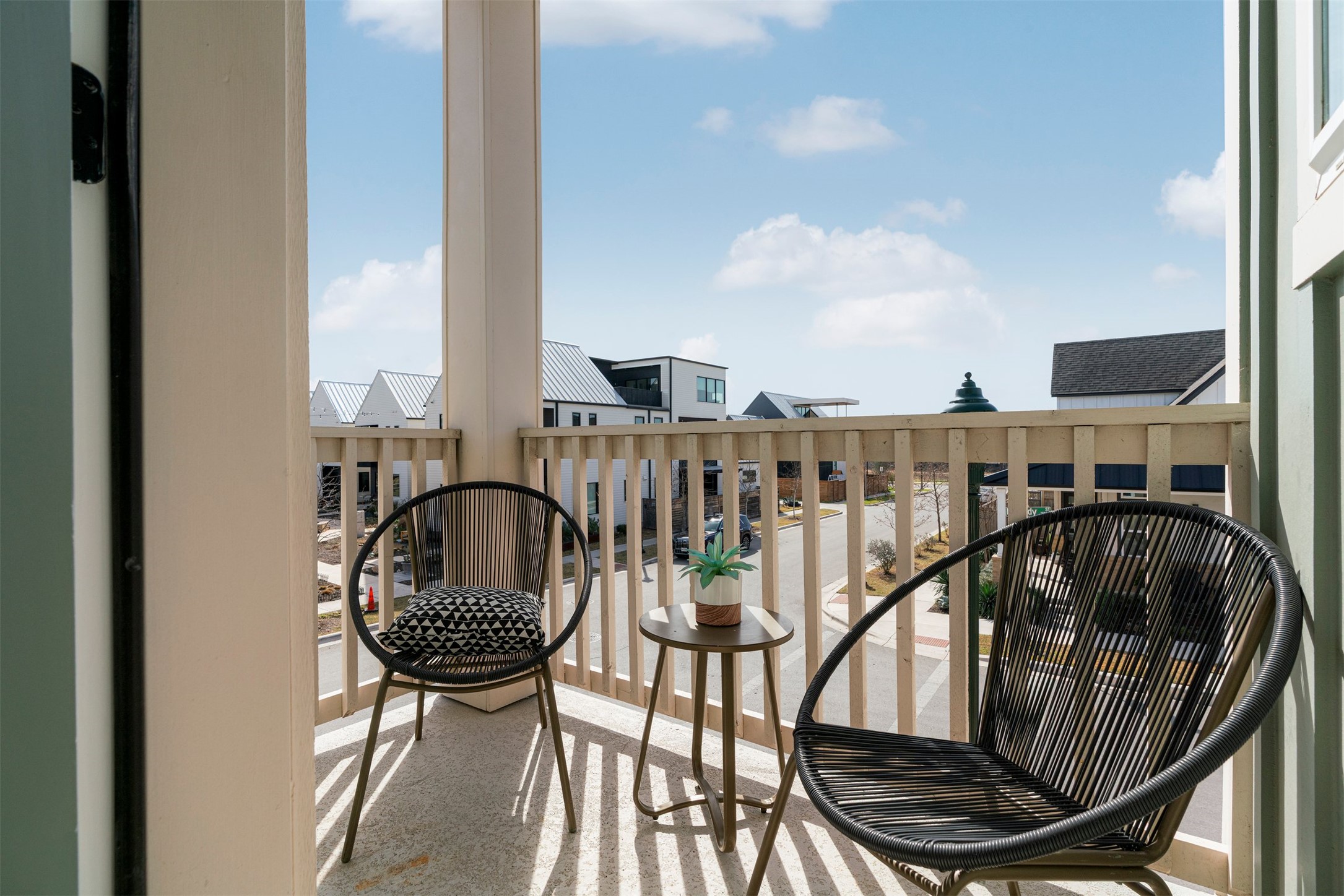 3900 Taniguchi Street Austin, TX 78723 - Photo 16 of 39 A balcony off the living room offers a slice of serenity, where you can step out and take in the view, letting the peaceful surroundings set the tone for your day.