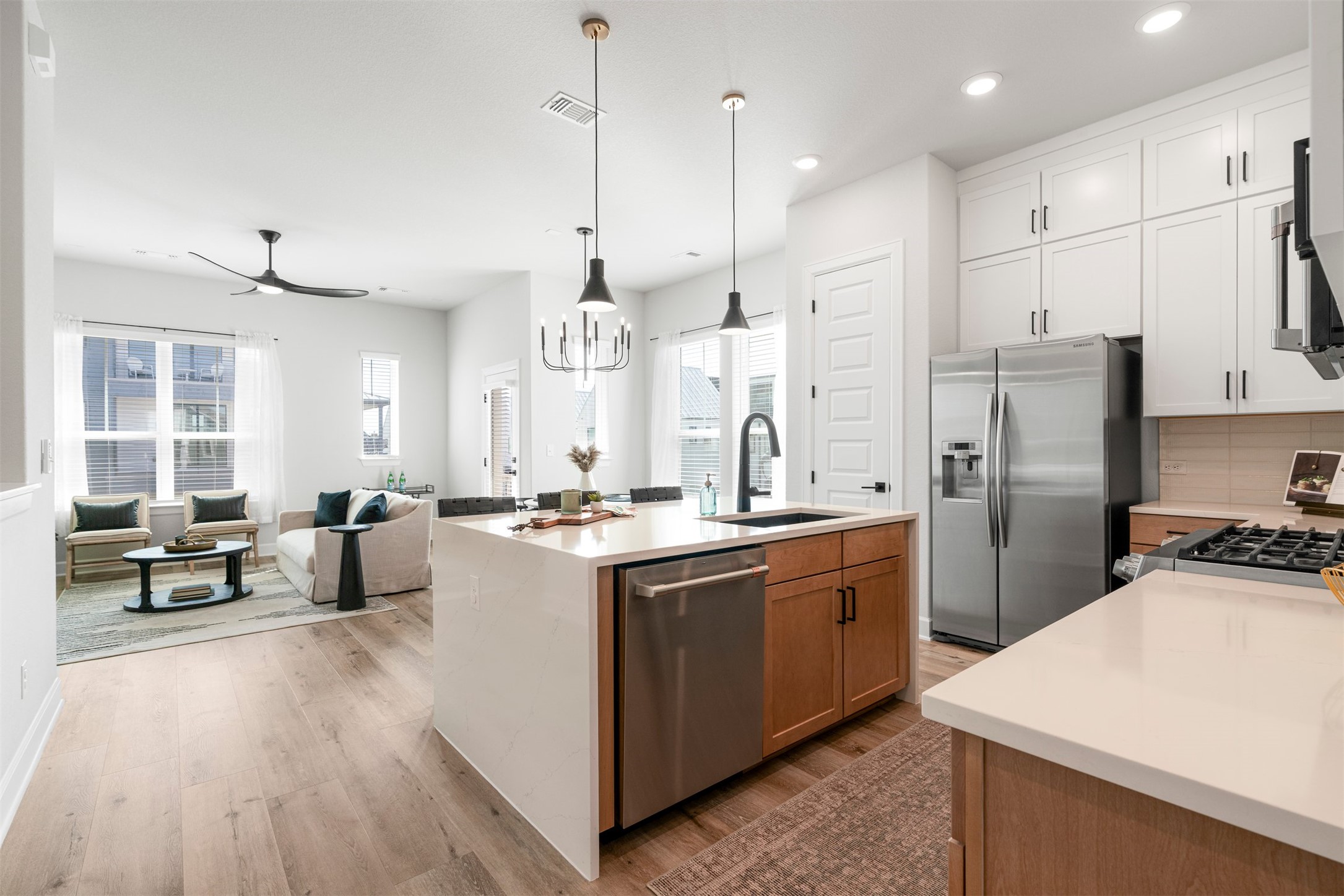 3900 Taniguchi Street Austin, TX 78723 - Photo 23 of 39 The kitchen sits just steps from the dining area, making it easy to pass plates across, refill drinks without missing a story, and keep everyone connected from prep to dessert without the back-and-forth.