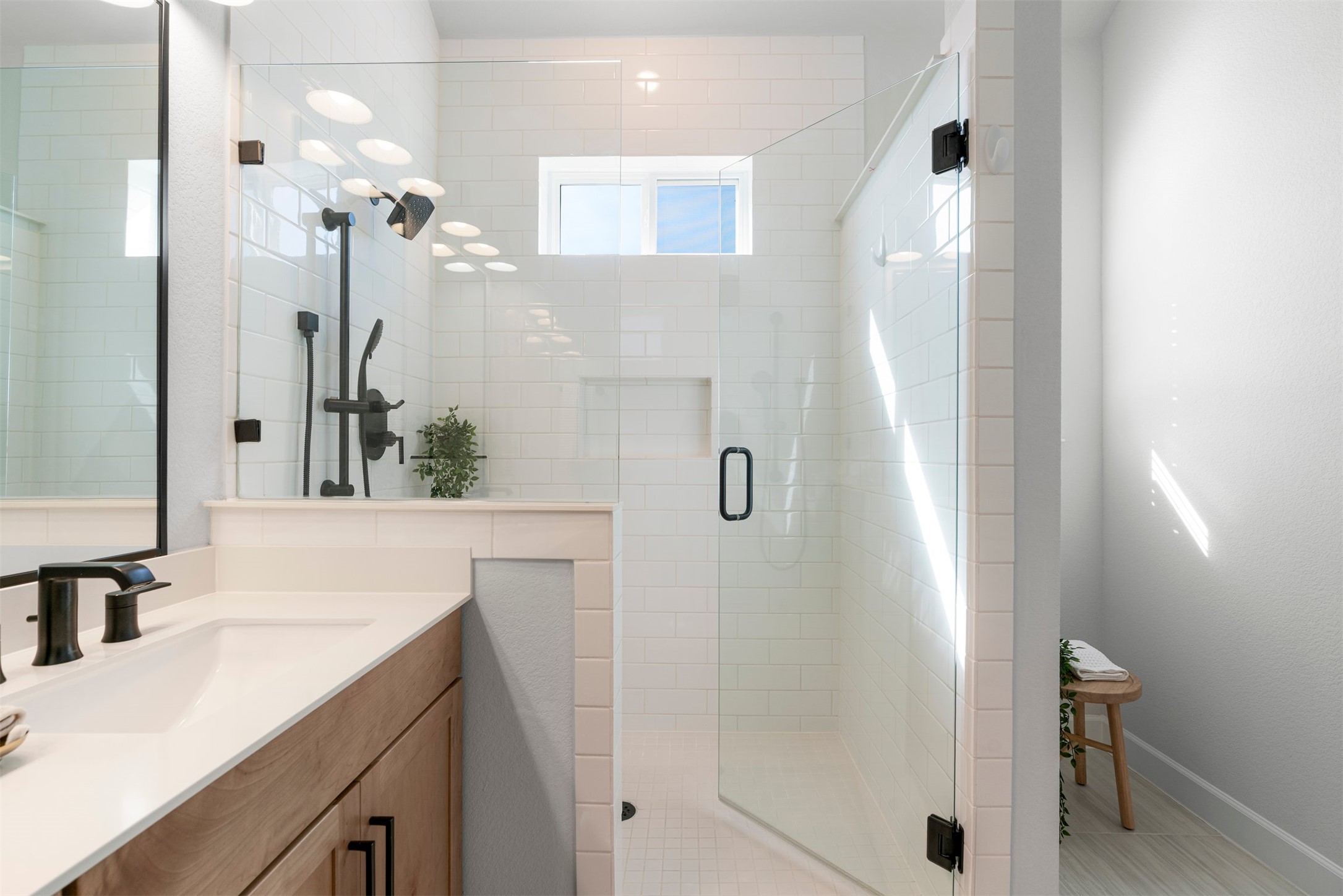 3900 Taniguchi Street Austin, TX 78723 - Photo 28 of 39 The ensuite bath includes dual vanities with generous counter space, making it easy for two people to get ready at the same time.