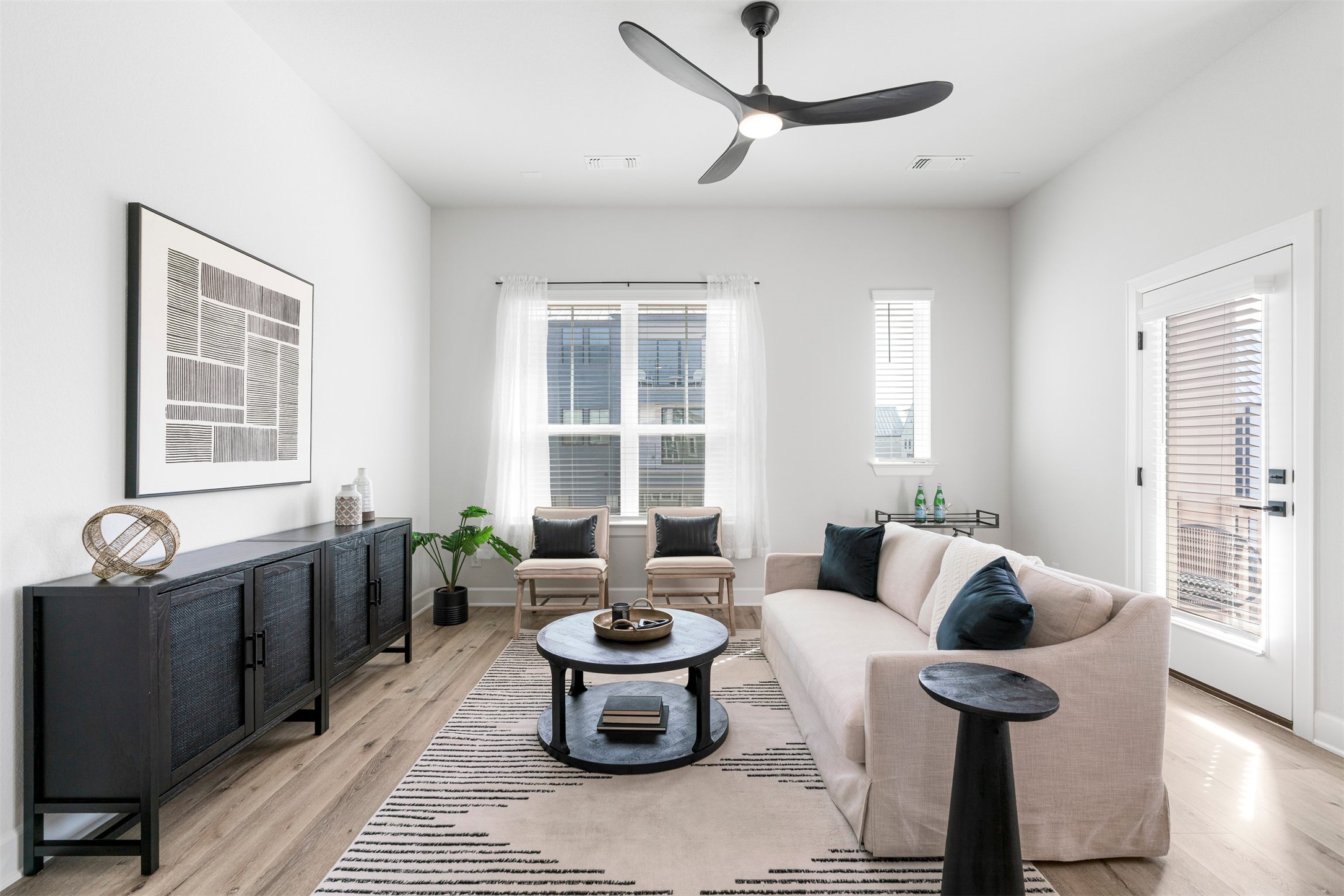 3900 Taniguchi Street Austin, TX 78723 - Photo 3 of 39 The large living room offers flexibility for seating and entertaining options.