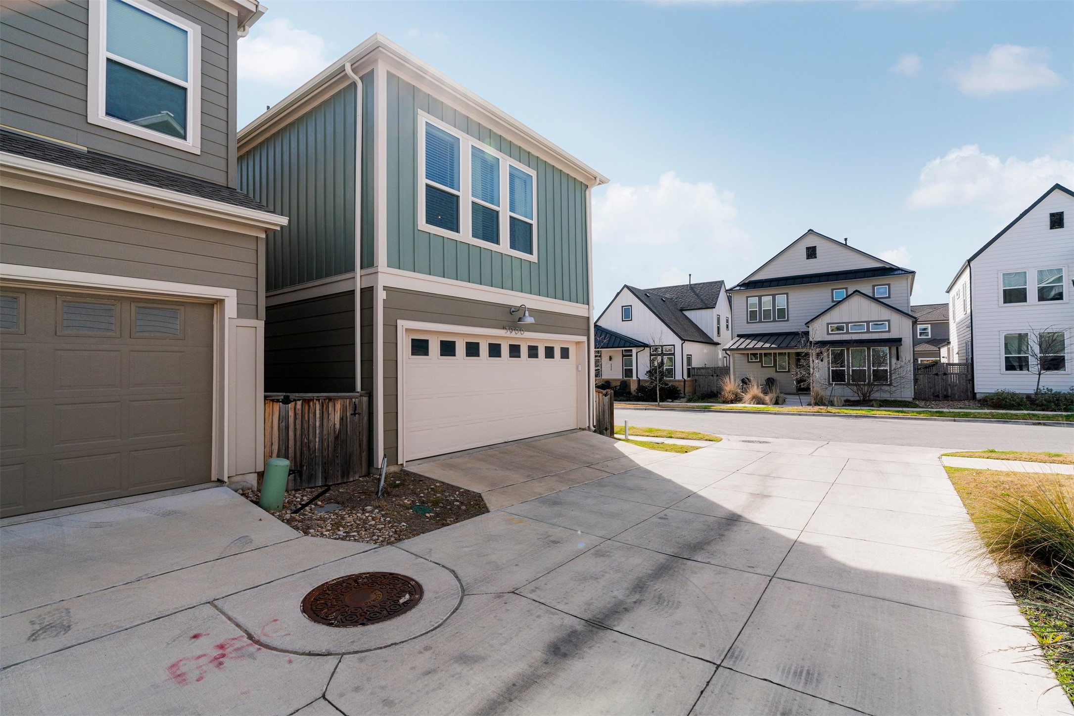 3900 Taniguchi Street Austin, TX 78723 - Photo 33 of 39 The 2-car garage provides enclosed parking plus extra room along the sides for storage, bikes, or gear, keeping everyday items out of sight but close at hand.