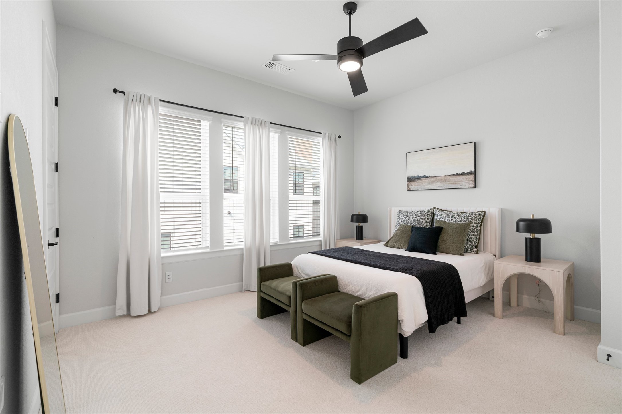 3900 Taniguchi Street Austin, TX 78723 - Photo 4 of 40 a spacious bedroom with a bed and a chandelier