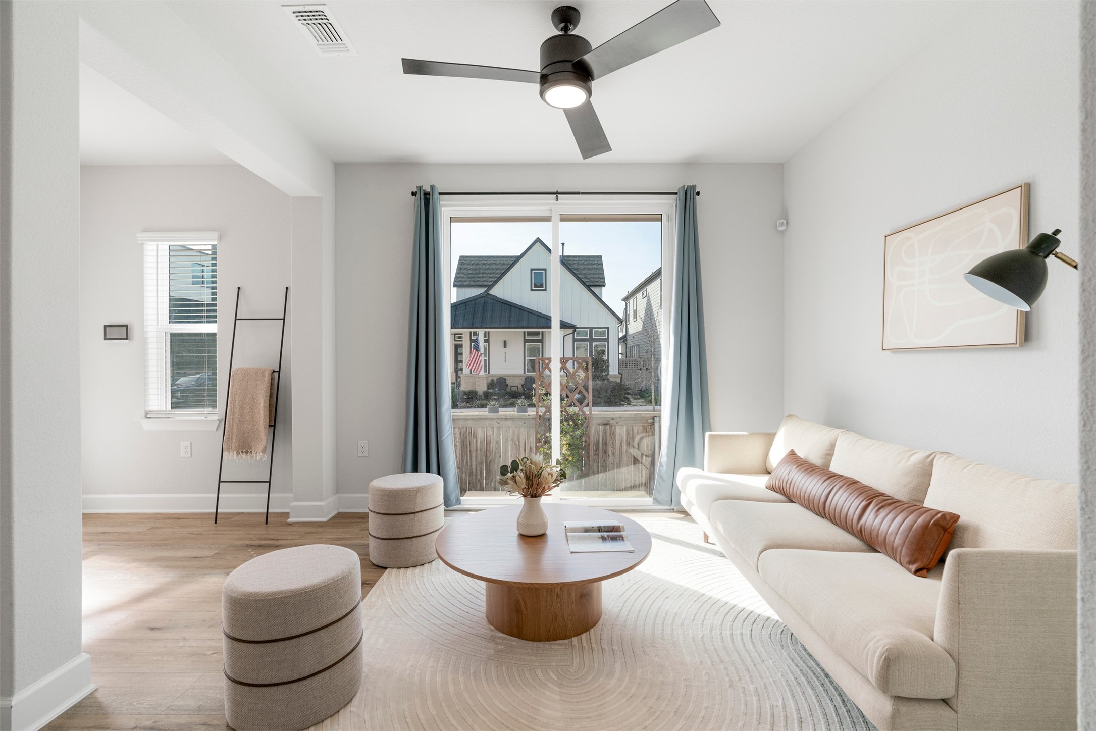 3900 Taniguchi Street Austin, TX 78723 - Photo 6 of 40 a living room with patio furniture and a potted plant