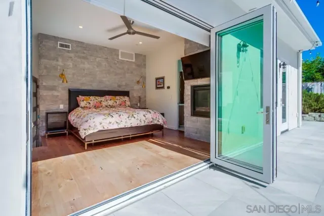 a bedroom with a bed and a mirror