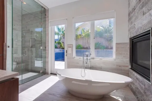 a bath tub sitting in front of a bathroom