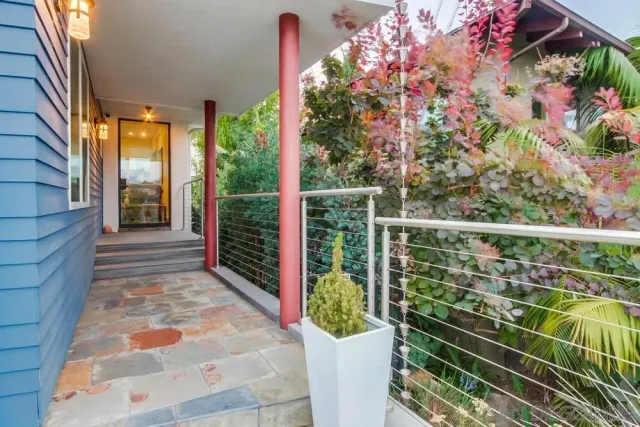 a balcony with view of outdoor space
