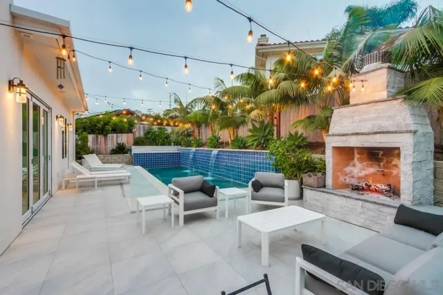 a building outdoor space with patio furniture and potted plants