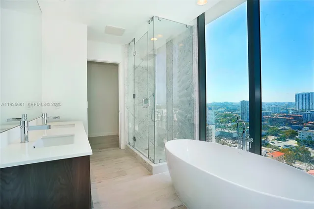 a bathroom with a sink mirror toilet and bathtub