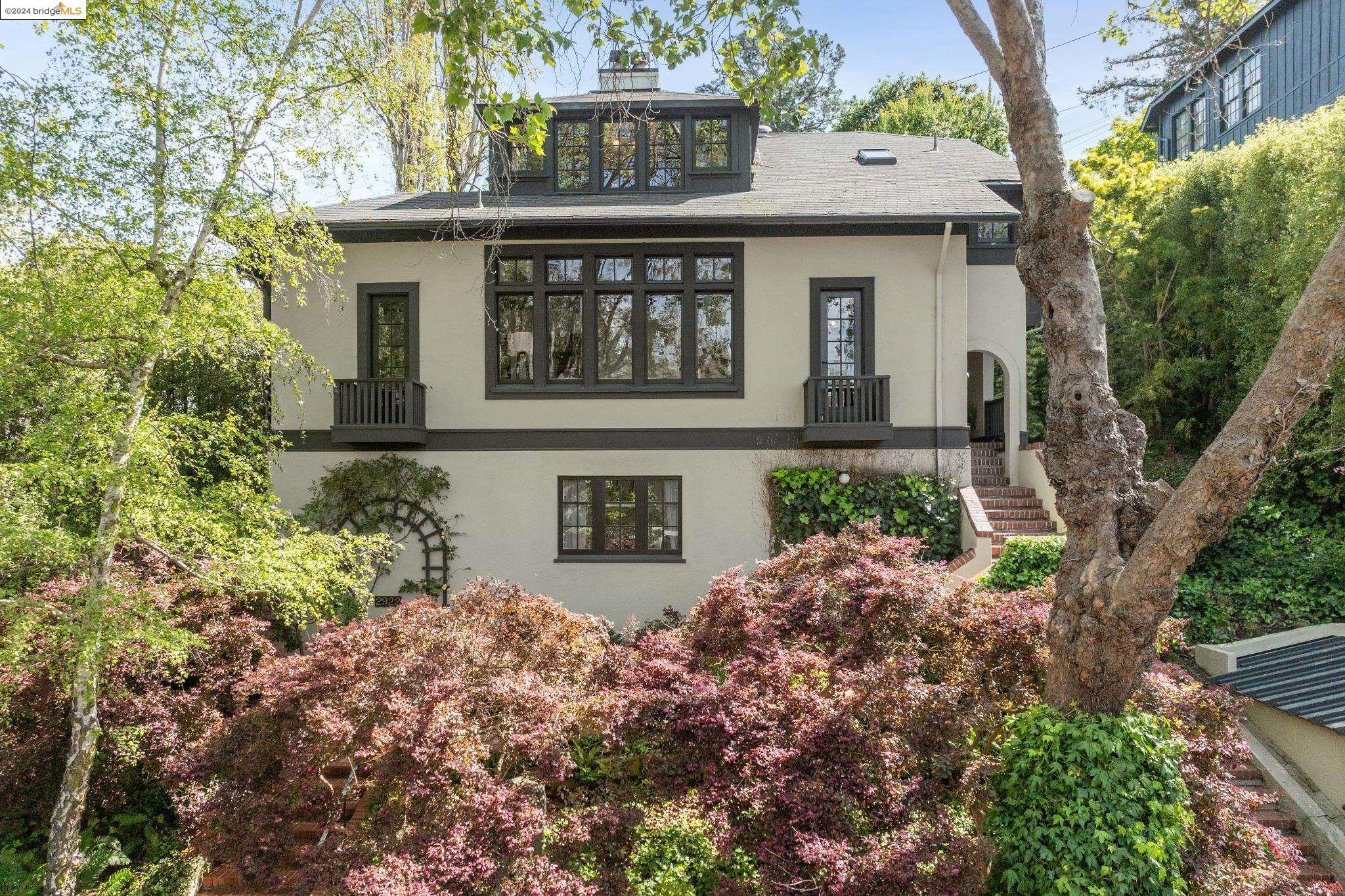 a view of a house with a small yard and plants
