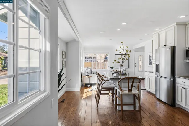 a view of a dining room with furniture window and wooden floor