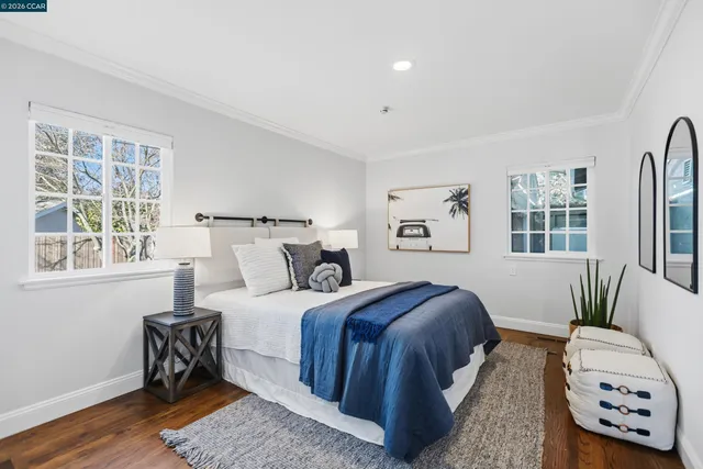 a bathroom with a granite countertop toilet sink and mirror