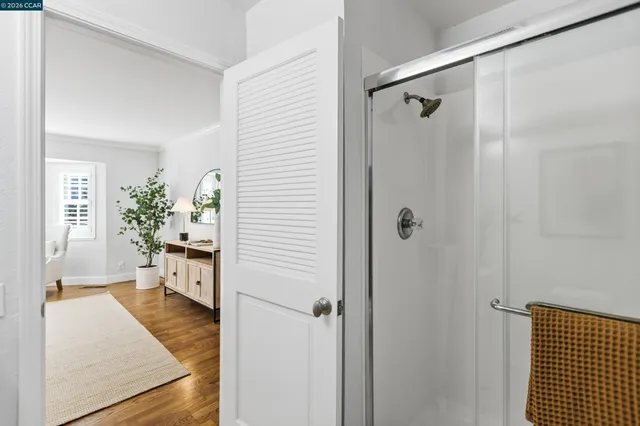 a view of a hallway with dining area and glass door