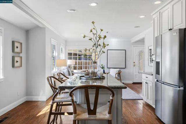 a view of a dining room with furniture and wooden floor