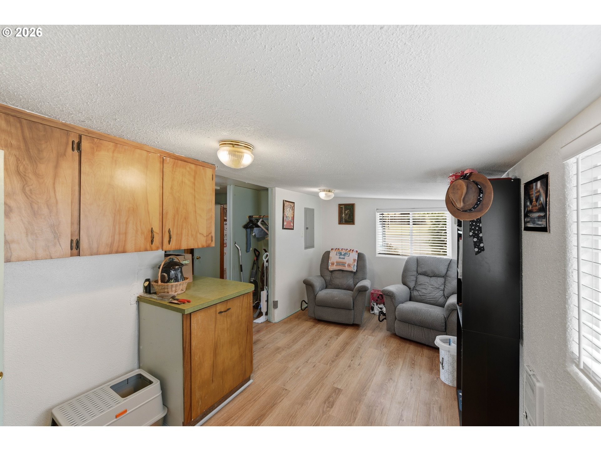 1955 Maple Street North Bend, OR 97459 - Photo 23 of 48 a living room with furniture window and a wooden floor
