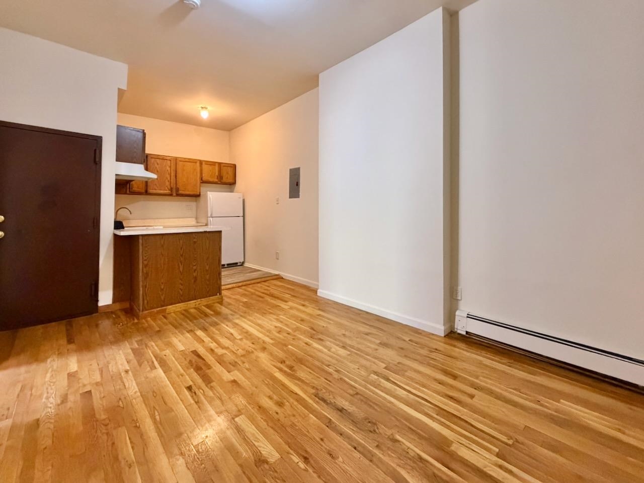 415 1st Street, Unit 2R Hoboken, NJ 07030 - Photo 1 of 22 a view of kitchen with wooden floor