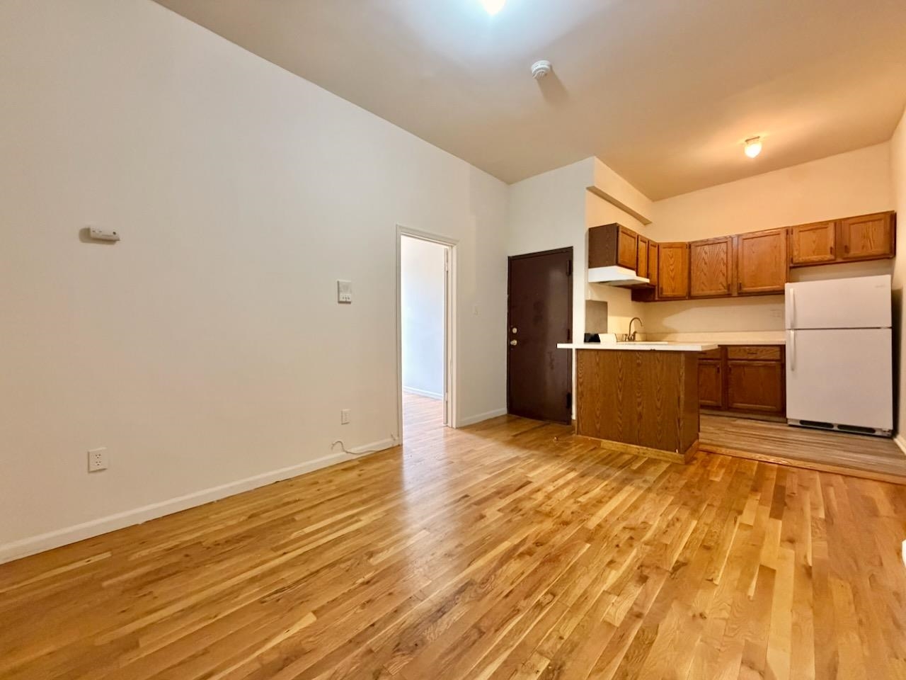 415 1st Street, Unit 2R Hoboken, NJ 07030 - Photo 2 of 22 a view of a kitchen with wooden floor