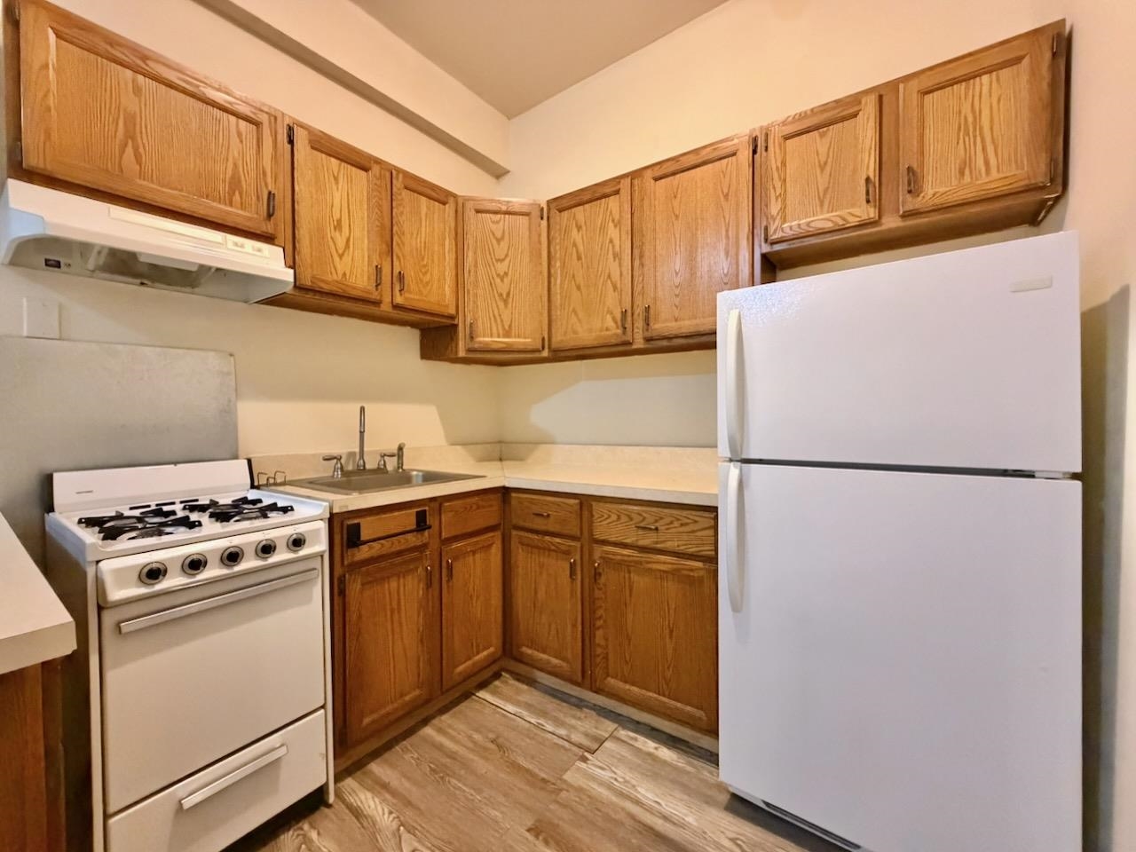 415 1st Street, Unit 2R Hoboken, NJ 07030 - Photo 6 of 22 a kitchen with stainless steel appliances granite countertop a refrigerator sink stove and cabinets