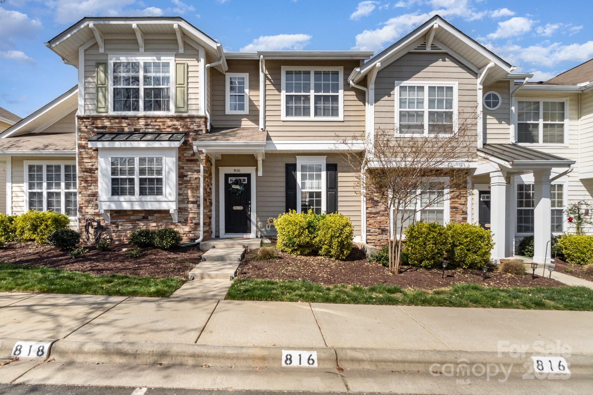 816 Gentlewinds Court Fort Mill, SC 29708 - Photo 1 of 19 a front view of a house with garden