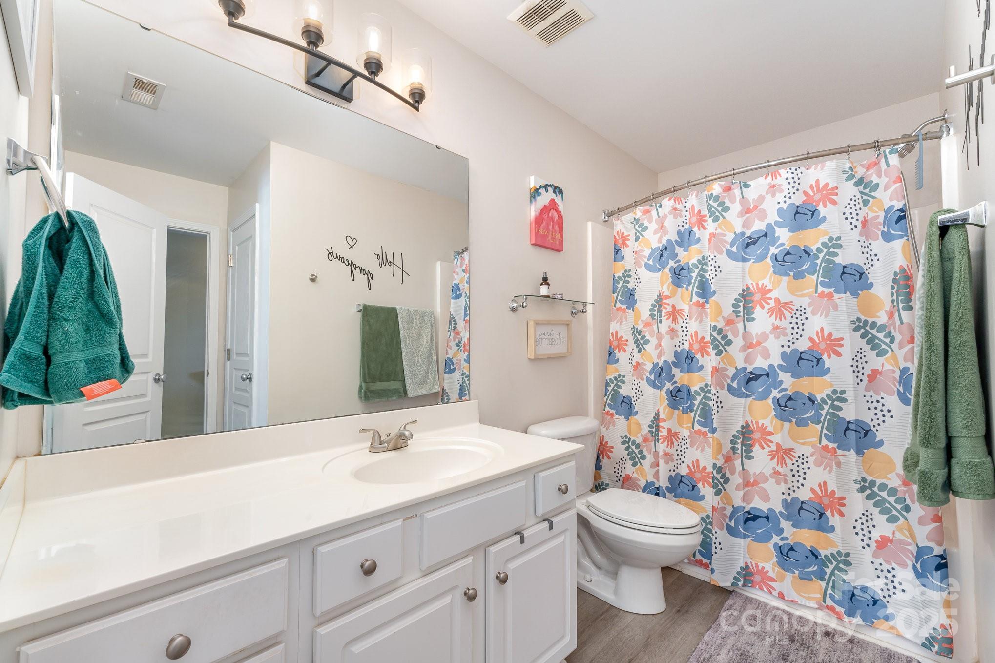 816 Gentlewinds Court Fort Mill, SC 29708 - Photo 11 of 19 a bathroom with a sink toilet and shower