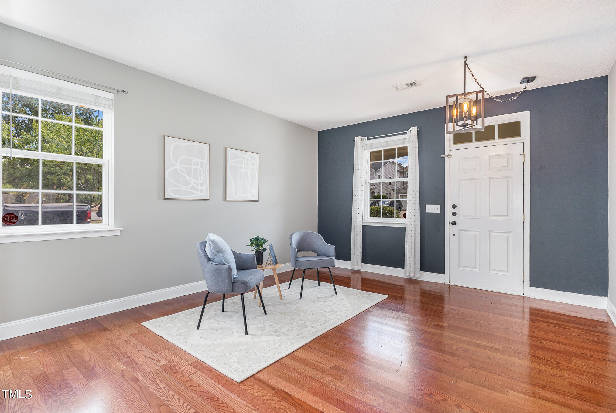 8814 Elizabeth Bennet Place Raleigh, NC 27616 - Photo 6 of 28 a view of a livingroom with furniture and window