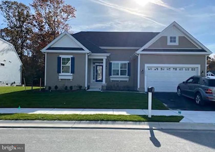 30246 Piping Plover Drive Millsboro, DE 19966 - Photo 1 of 25 a front view of a house with a yard