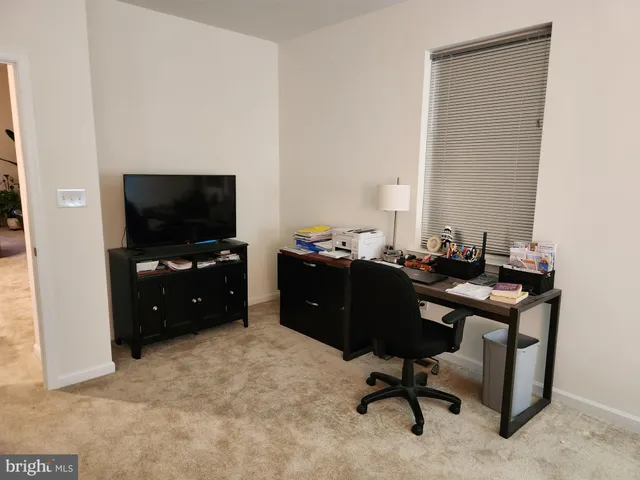 a view of a workspace with furniture