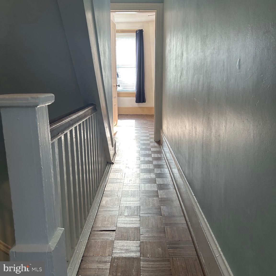 431 Broad Street Spring City, PA 19475 - Photo 29 of 42 a view of a hallway with wooden floor and staircase