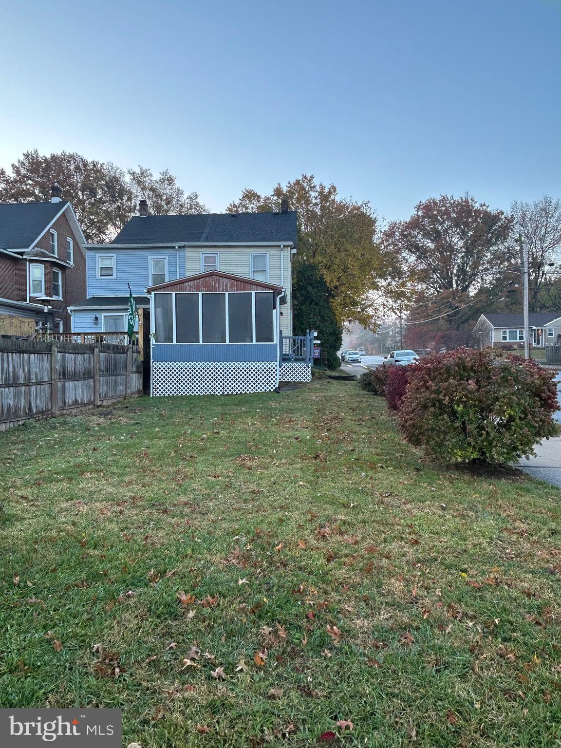 431 Broad Street Spring City, PA 19475 - Photo 40 of 42 a view of a yard in front of a house with a large tree