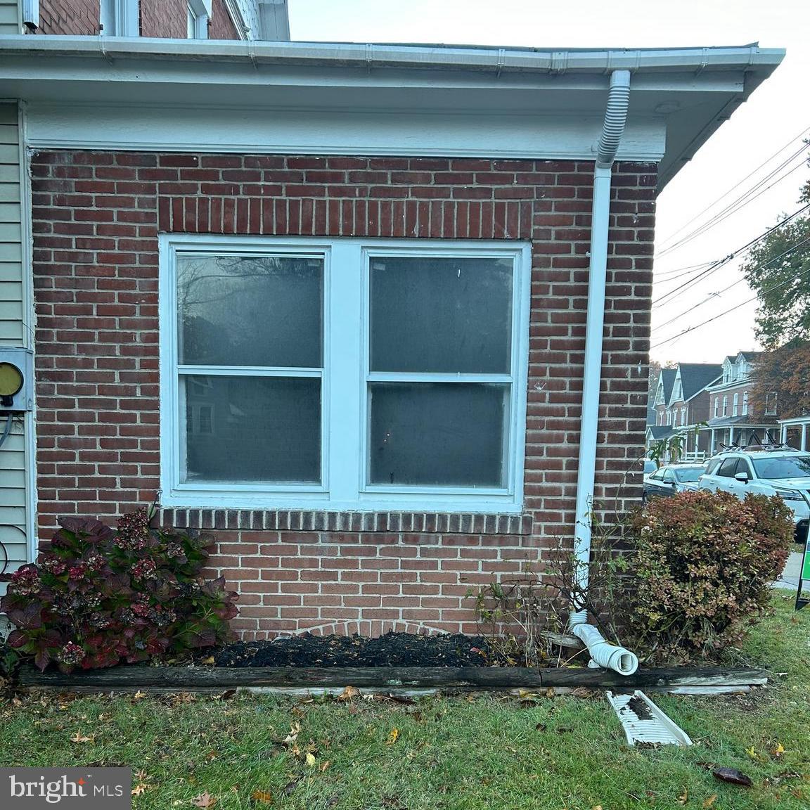 431 Broad Street Spring City, PA 19475 - Photo 4 of 42 a view of a house with a small yard and wooden fence