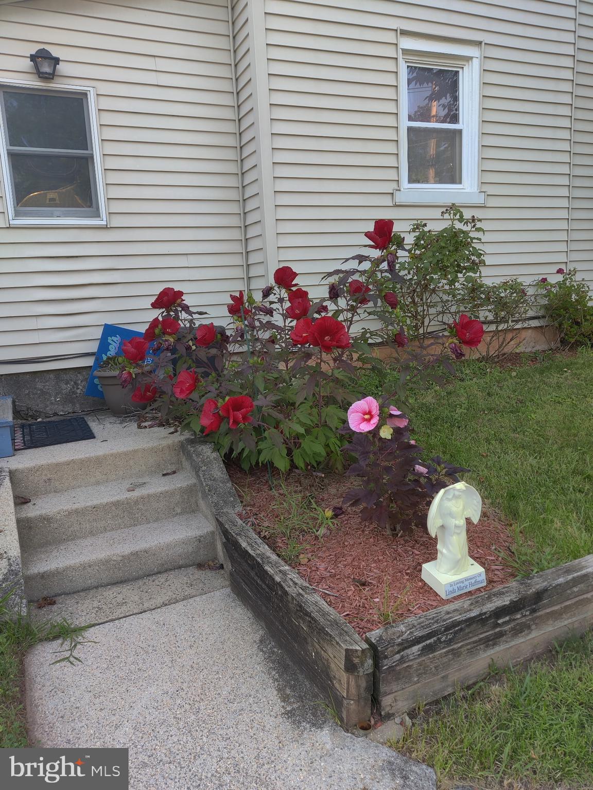 431 Broad Street Spring City, PA 19475 - Photo 42 of 42 a front view of a house with a yard and a garage