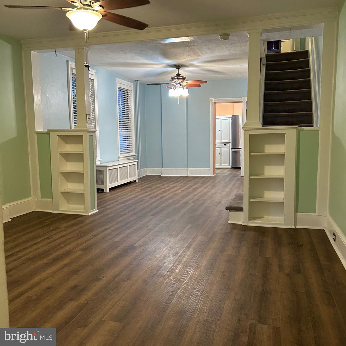 431 Broad Street Spring City, PA 19475 - Photo 8 of 42 wooden floor in an empty room with a window