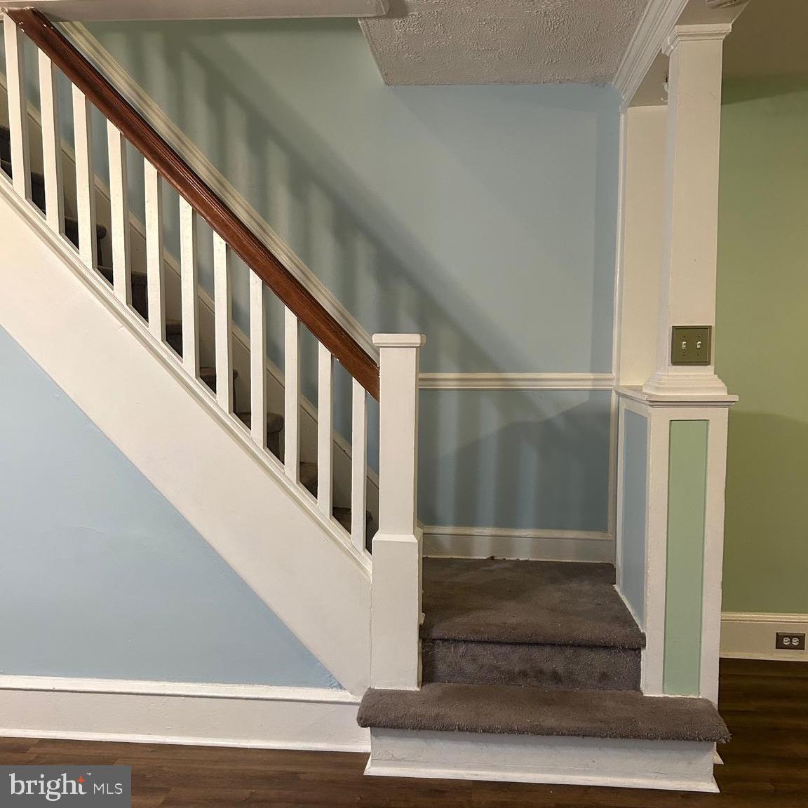 431 Broad Street Spring City, PA 19475 - Photo 9 of 42 a view of staircase with lots of frames on wall and a window