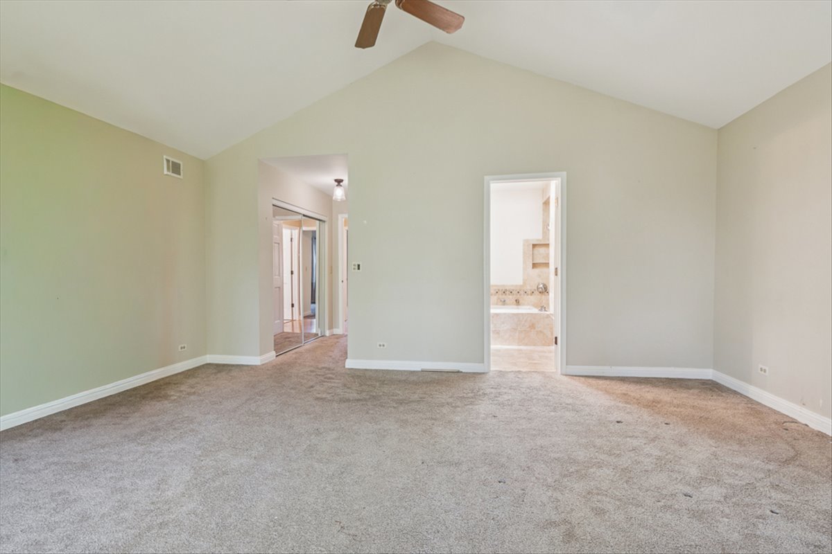 417 River Bluff Circle Naperville, IL 60540 - Photo 12 of 20 an empty room with closet and a window
