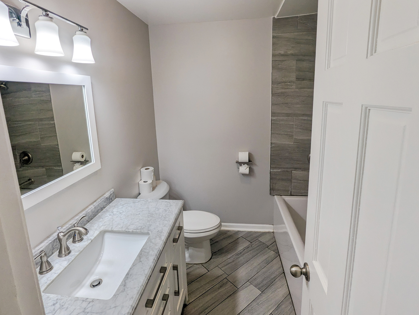 1369 North Quentin Road Palatine, IL 60067 - Photo 5 of 12 a bathroom with a sink a toilet and shower