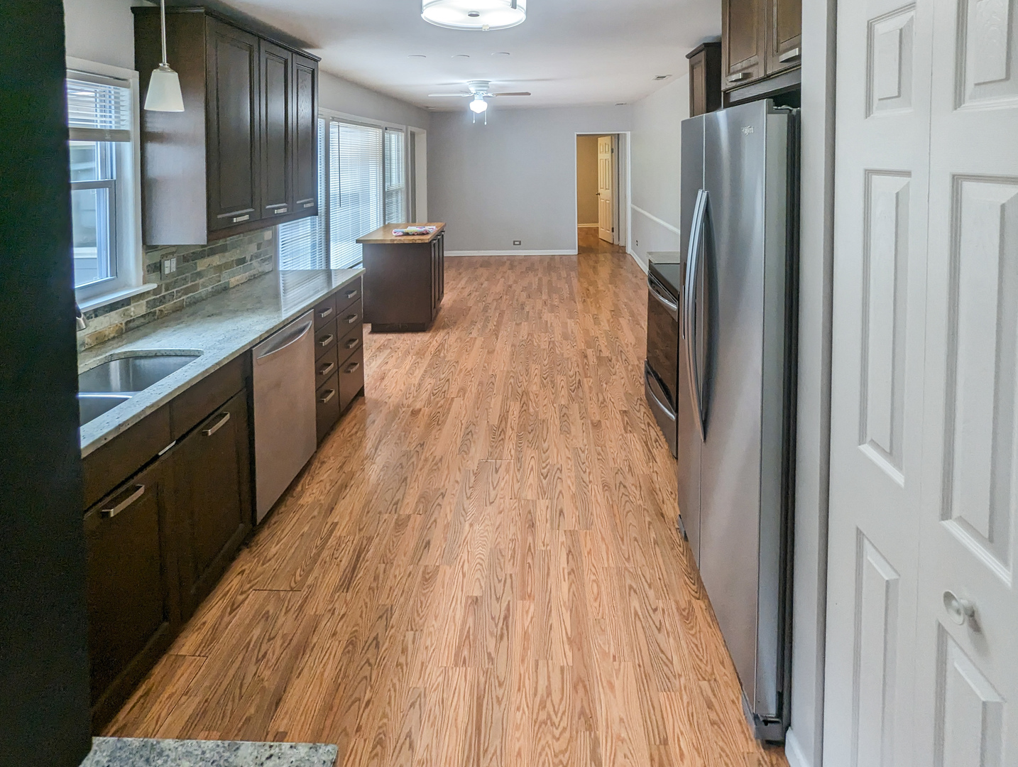 1369 North Quentin Road Palatine, IL 60067 - Photo 7 of 12 a view of a kitchen from the hallway