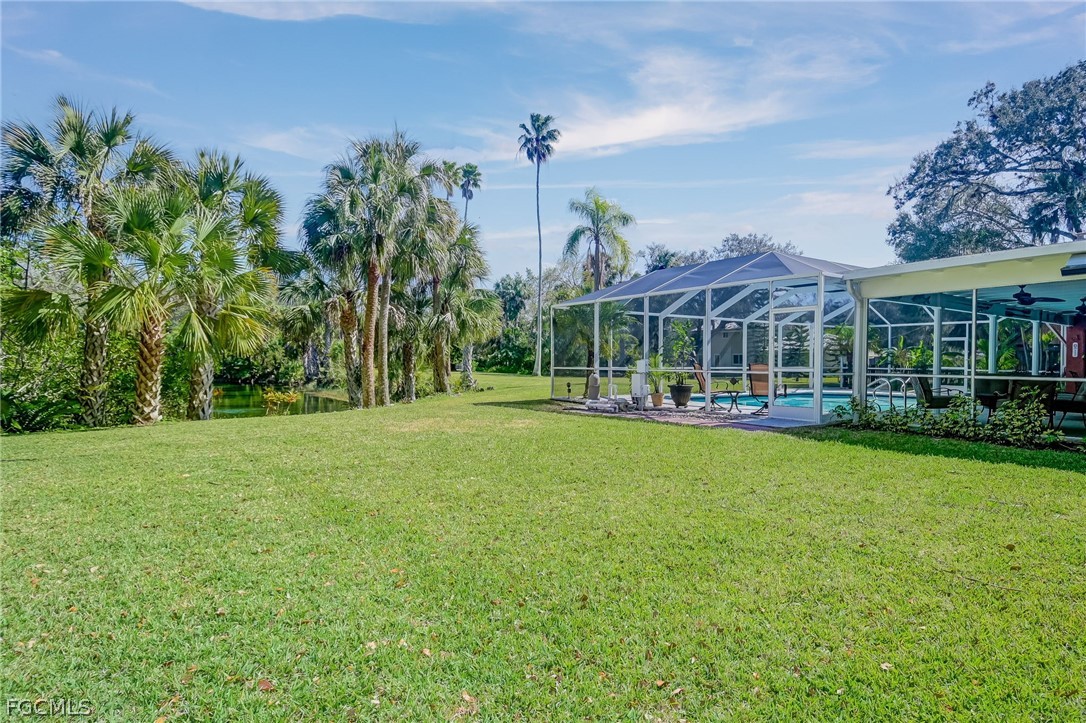 4601 Orange River Loop Road Fort Myers, FL 33905 - Photo 11 of 50 a view of a house with a big yard and potted plants