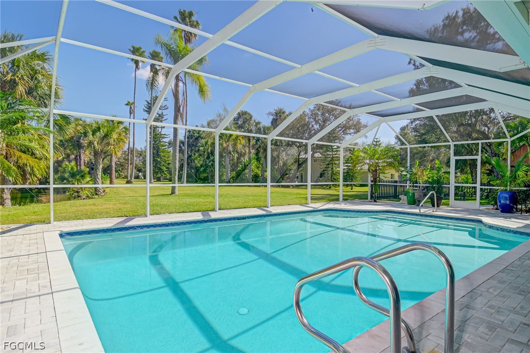 4601 Orange River Loop Road Fort Myers, FL 33905 - Photo 13 of 50 a view of a backyard with swimming pool and porch