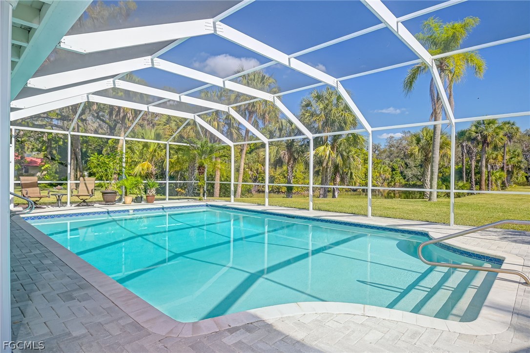 4601 Orange River Loop Road Fort Myers, FL 33905 - Photo 14 of 50 a view of a backyard with a swimming pool