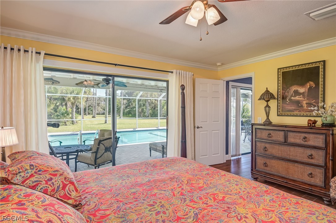 4601 Orange River Loop Road Fort Myers, FL 33905 - Photo 20 of 50 a bedroom with a bed and large windows