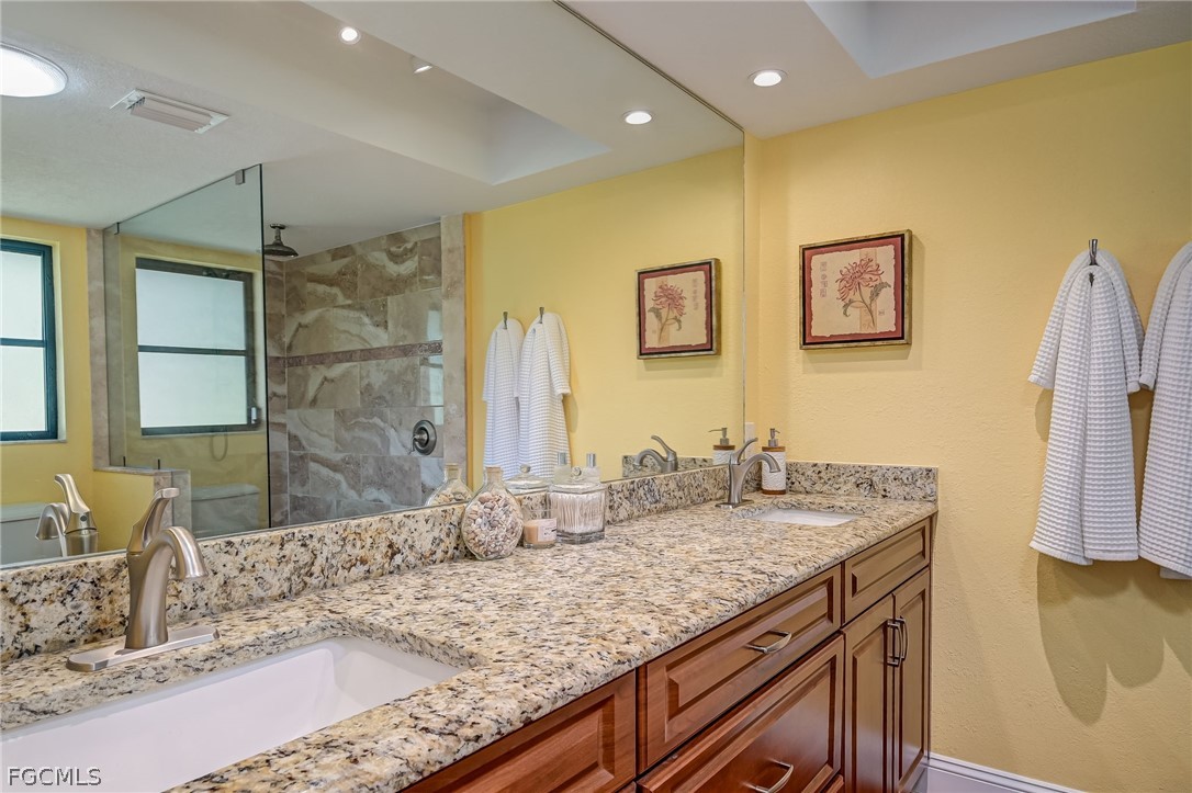 4601 Orange River Loop Road Fort Myers, FL 33905 - Photo 21 of 50 a bathroom with a granite countertop sink and a mirror