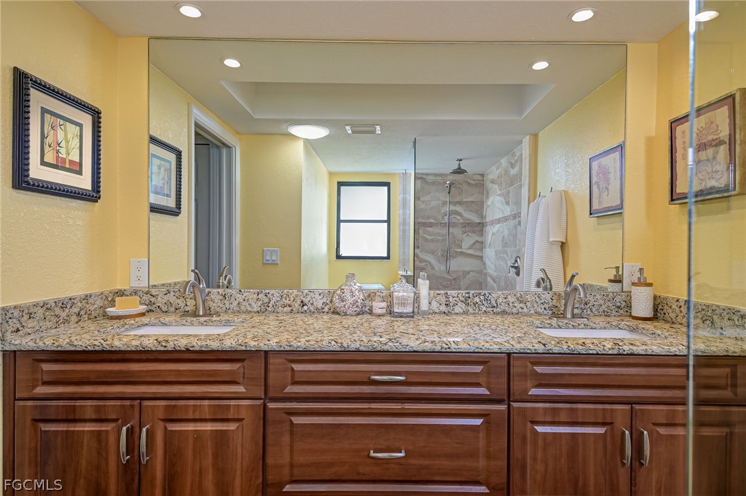 4601 Orange River Loop Road Fort Myers, FL 33905 - Photo 22 of 50 a bathroom with a granite countertop sink and a mirror