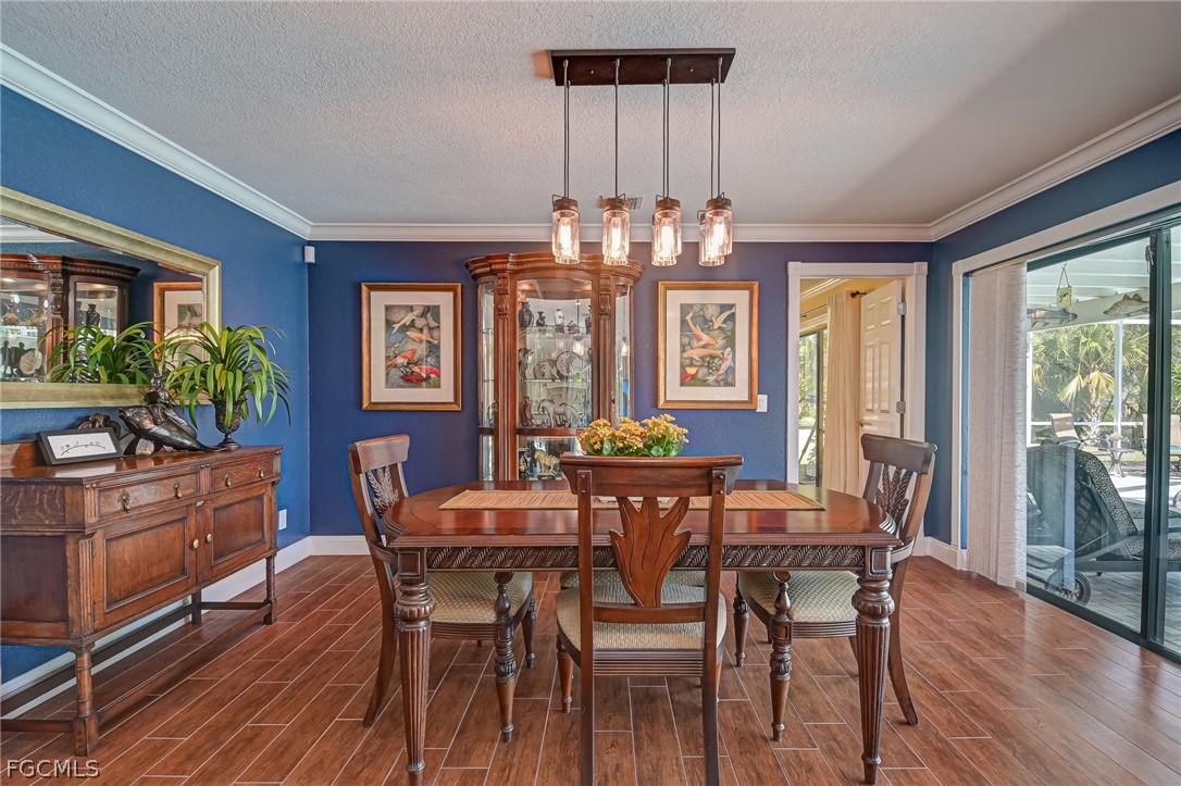 4601 Orange River Loop Road Fort Myers, FL 33905 - Photo 24 of 50 a view of a dining room with furniture window and wooden floor