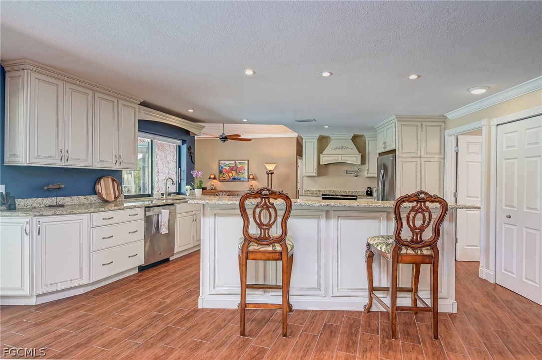 4601 Orange River Loop Road Fort Myers, FL 33905 - Photo 30 of 50 a kitchen with granite countertop furniture and a dining table