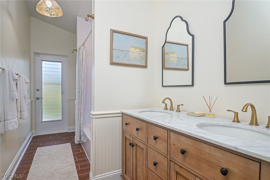 4601 Orange River Loop Road Fort Myers, FL 33905 - Photo 35 of 50 a bathroom with a granite countertop double vanity sink and two mirror