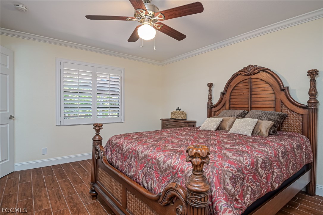 4601 Orange River Loop Road Fort Myers, FL 33905 - Photo 37 of 50 a bedroom with a bed and a window