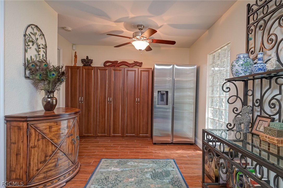 4601 Orange River Loop Road Fort Myers, FL 33905 - Photo 39 of 50 a view of a hallway with wooden floor and entryway