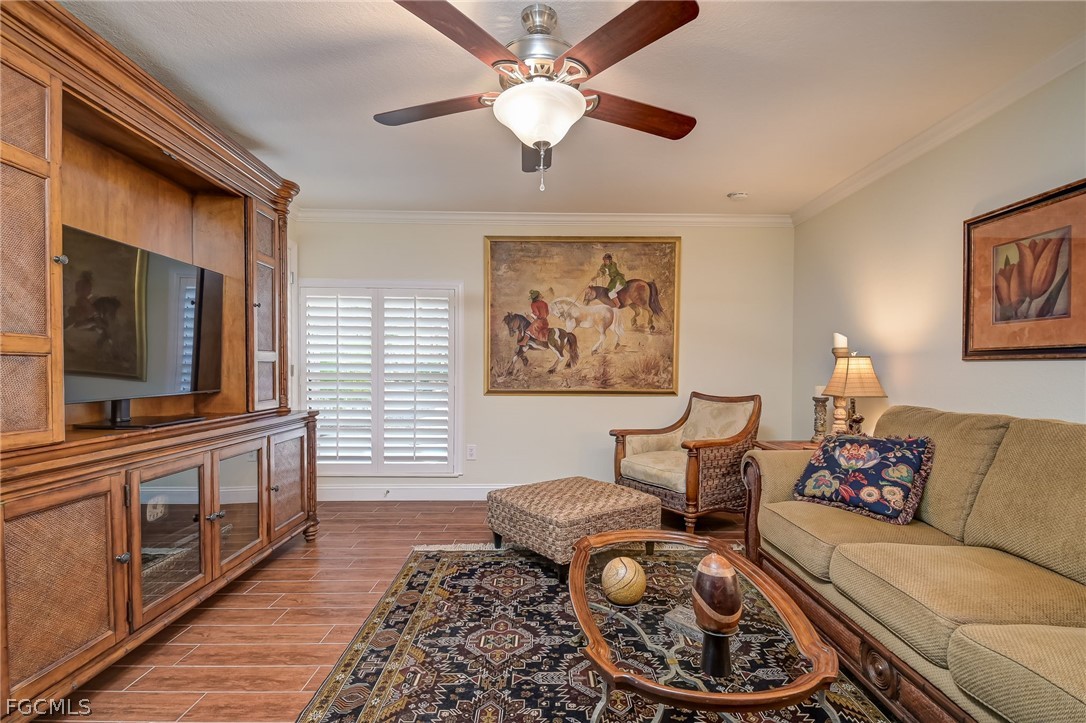 4601 Orange River Loop Road Fort Myers, FL 33905 - Photo 40 of 50 a living room with furniture and a flat screen tv