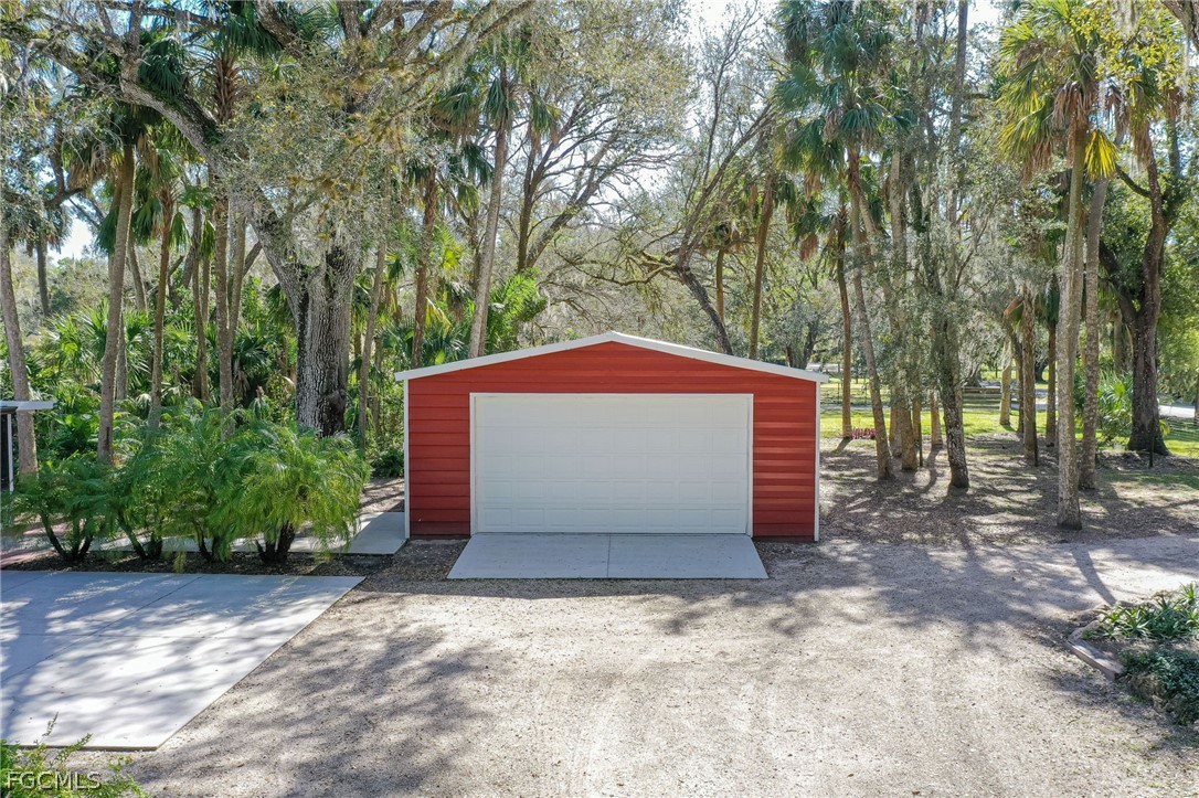 4601 Orange River Loop Road Fort Myers, FL 33905 - Photo 8 of 50 a front view of a house with a yard and garage