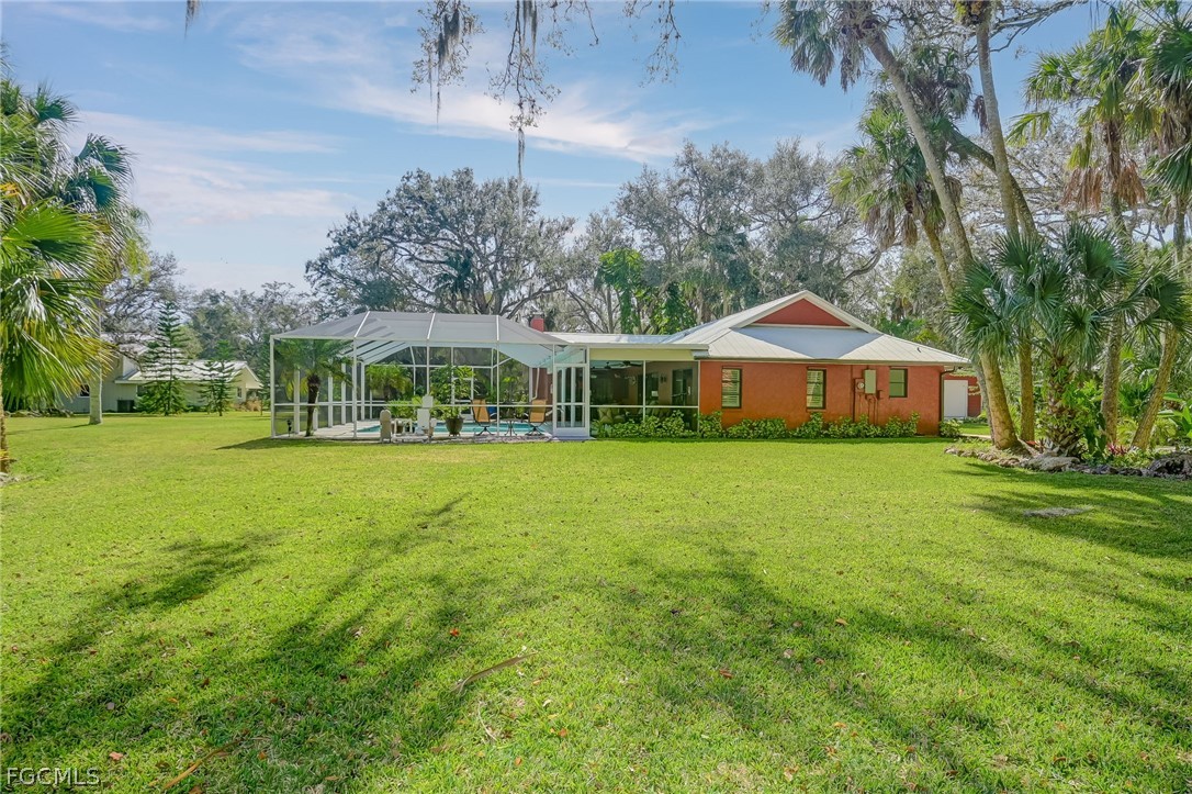 4601 Orange River Loop Road Fort Myers, FL 33905 - Photo 10 of 50 a front view of a house with garden